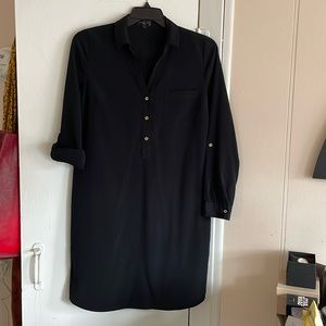 Black shirt dress with gold accent buttons. The Limited.